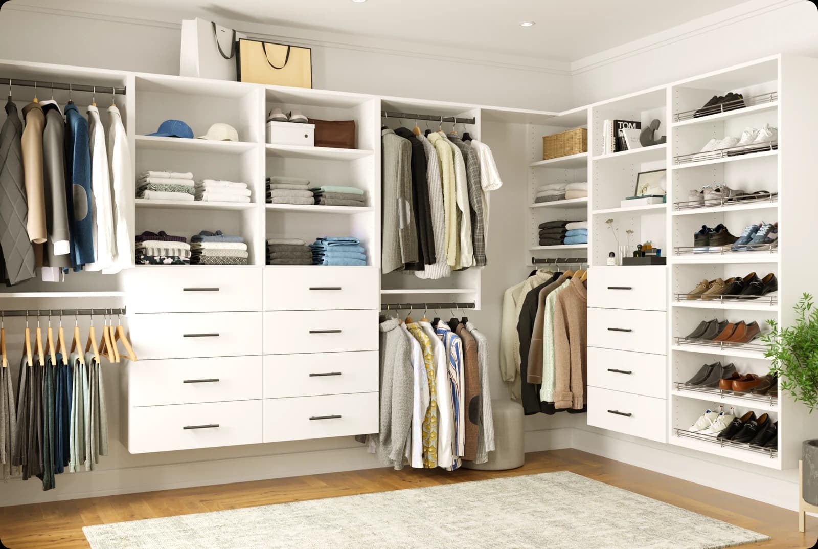 White walk-in closet arranged along adjoining walls with hanging sections, drawers and shoe shelves.